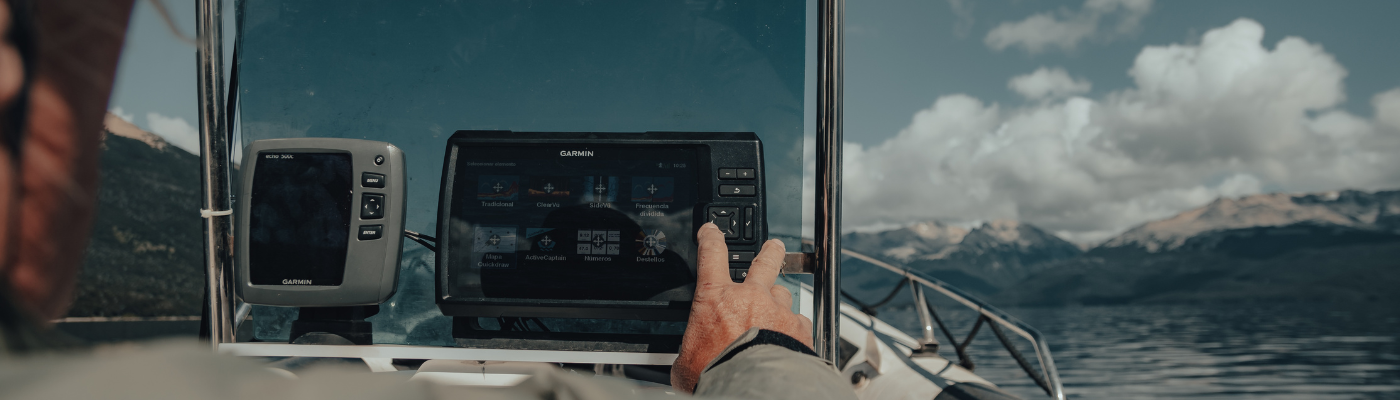 A man touching the screen of a Garmin GPS