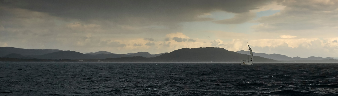 sailboat in dark conditions