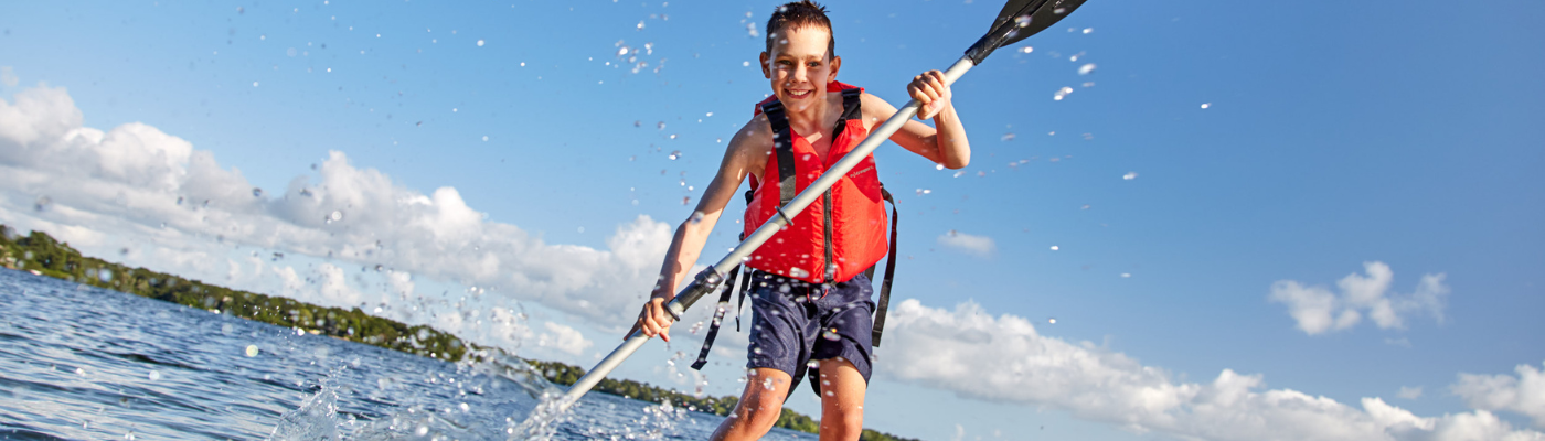 Woman and Kid on paddle board 
