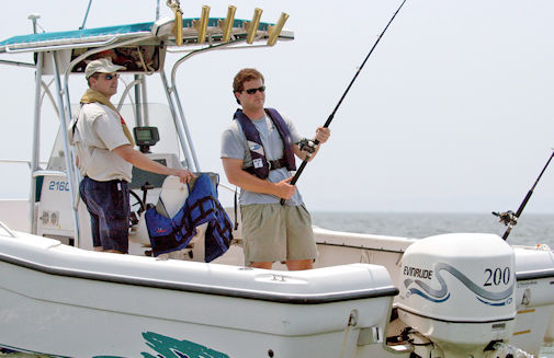 Two Men On Boat Fishing