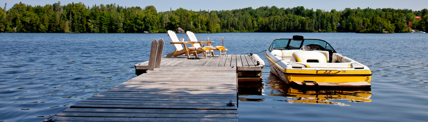 a yellow boat at a dock